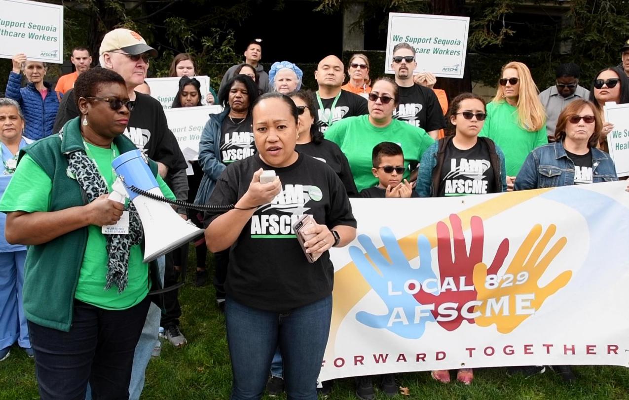 Sequoia Hospital members hold an action outside of the medical facility in Redwood City