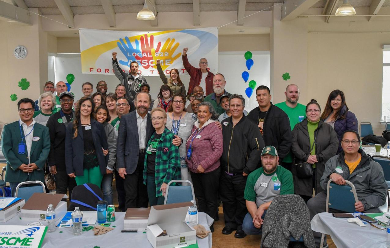 California State Sen. Jerry Hill takes a photo with AFSCME Local 829 members at their rally in Belmont