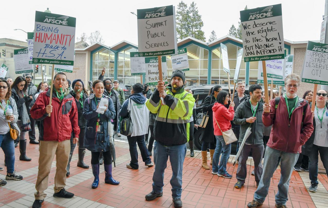 AFSCME Local 829 members hold a strike outside of the San Mateo County Government Center in Redwood City.
