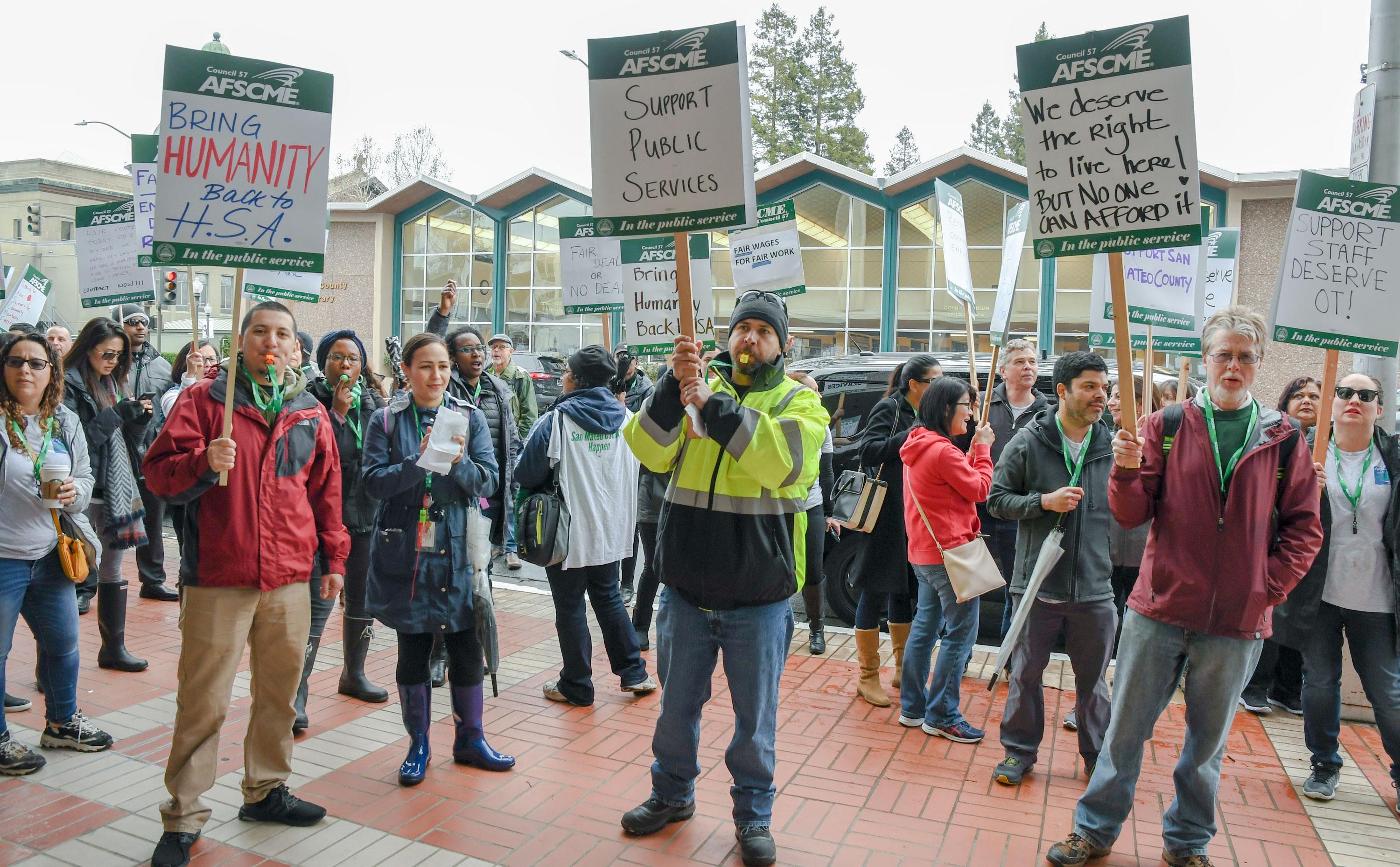 AFSCME Local 829 members hold a strike outside of the San Mateo County Government Center in Redwood City.