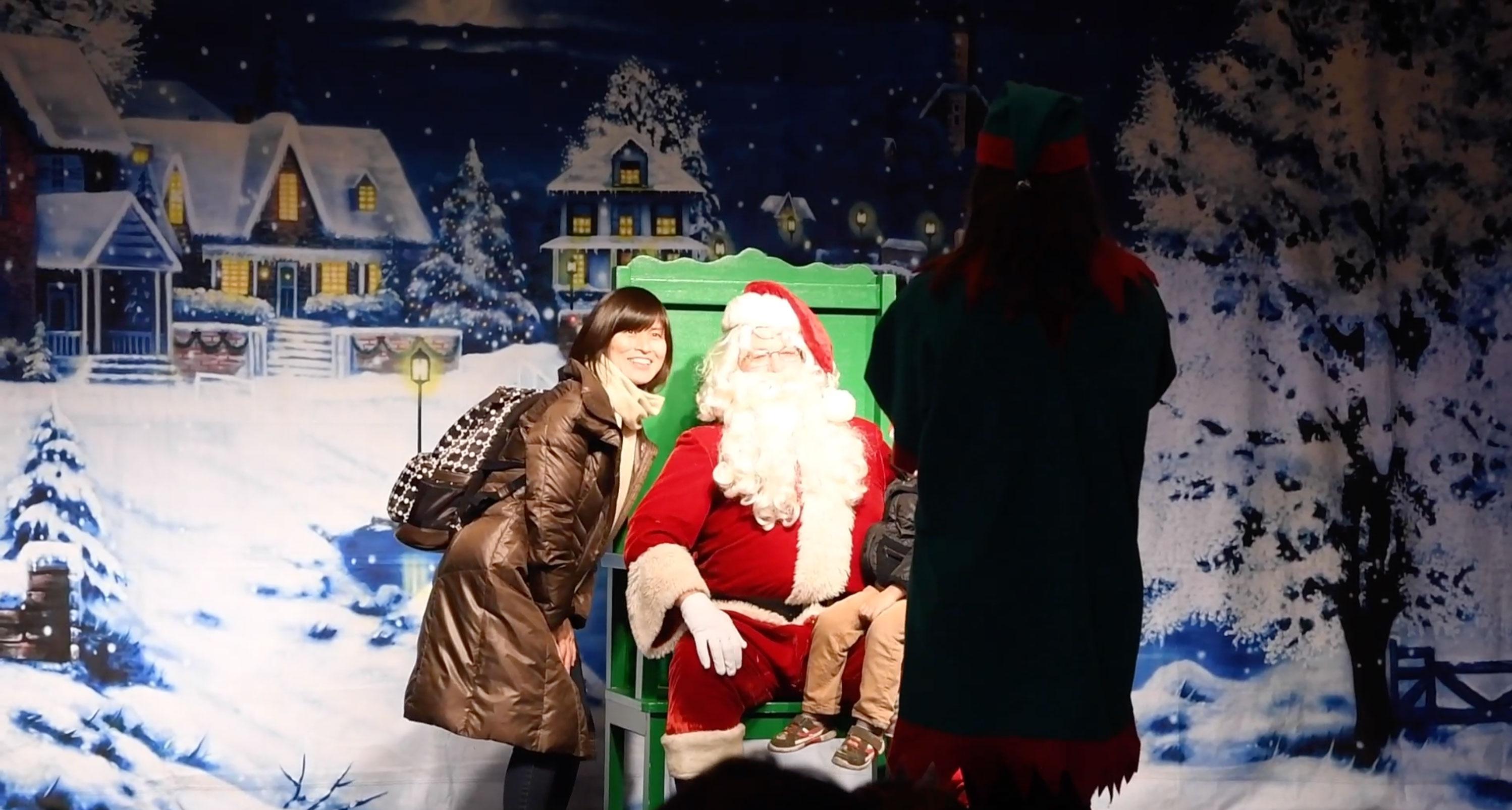 A family takes a photo with Santa during the Holiday Tree Lighting Ceremony in Santa Clara.