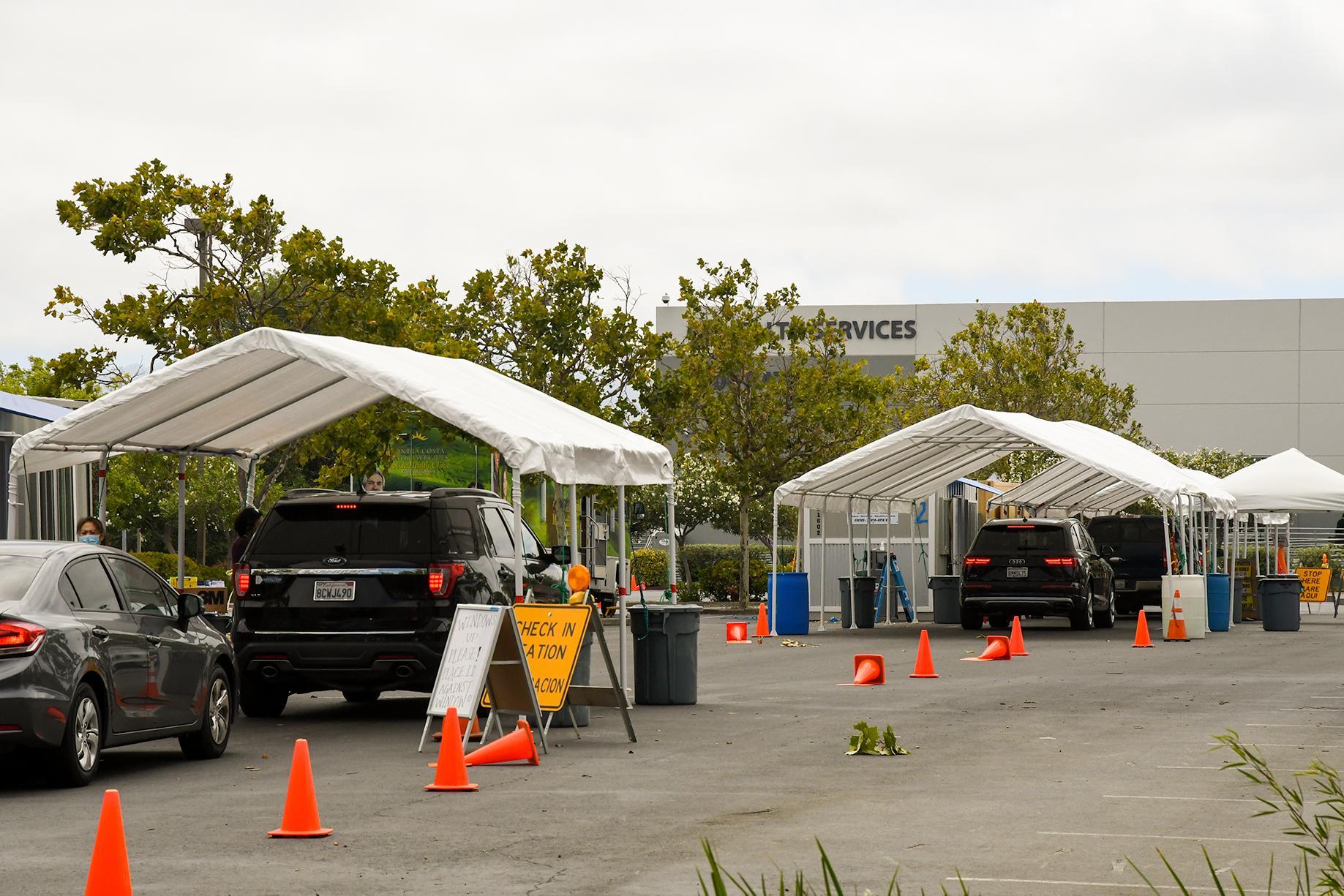 Vehicles pull in to COVID-19 testing site in Contra Costa County.